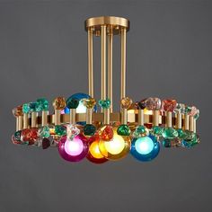 a multi colored chandelier hanging from a ceiling