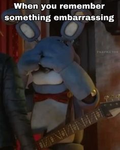 an image of a rabbit playing guitar with caption that reads, when you remember something embarassing