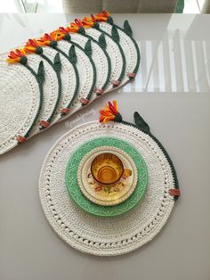 a table topped with plates and bowls filled with food next to each other on top of a white table