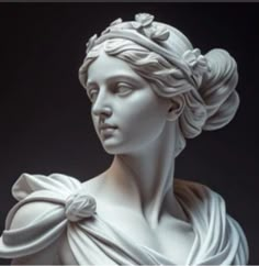 a statue of a woman with a flower in her hair