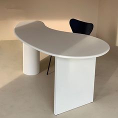 a white table and chair in a room with no one around it or someone else