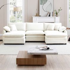 a large white sectional couch in a living room