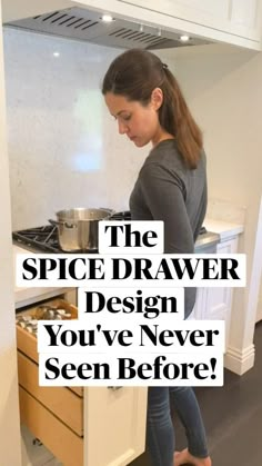 a woman standing in front of an open drawer filled with cans and pans next to a stove