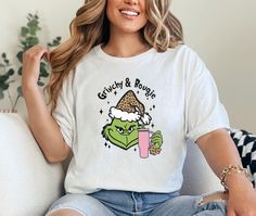 💚 Boujee Grinch T-Shirt | Funny Grinch Coffee Christmas Tee | Bougie Grinch Xmas Shirt Celebrate the season with sass in this Boujee Grinch T-Shirt! Perfect for those who love their coffee and a little holiday attitude, this shirt features a stylish Grinch with a bougie twist. Whether you're spreading festive vibes or enjoying your own cozy Grinchmas, this fun and quirky shirt is sure to turn heads at your next holiday gathering. A perfect gift for anyone with a love for both Christmas and a bit of Grinchy charm!  Boujee Grinch Shirt, Funny Christmas Tee, Grinch Xmas Tshirt  How To Order  1-) Please, check and review all the photos. 2-) Choose your t-shirt size and color. *Different styles of shirts may have different shades of same color choice due to different manufacturer brands. *For Grinch Tshirt, Boujee Christmas, Grinch Coffee, Funny Grinch, Grinch T Shirt, Grinch Shirt, Grinch Shirts, Coffee Christmas, Christmas Tshirt