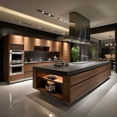 a modern kitchen with an island and stove