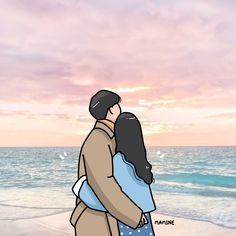 a man and woman hugging on the beach at sunset with an ocean in the background