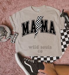 Checkered Mama Lightning Bolt Tee | Comfort Colors | Mom | Racetrack | Trendy | Checkerboard Shirt | Skateboard | Gifts for Her | Graphic This DTF screen print checkered lightning bolt MAMA shirt is going to be your new favorite shirt! It is super comfy and a perfect staple for your closet! Our shirts are super soft and we use quality transfers.  Comfort Colors: - Unisex Sizing - Size down for smaller fit & up for larger fit - 100% ring-spun cotton Shirt colors may vary slightly.  SHIRT CARE: - Mama Shirt Ideas, Checkerboard Shirt, Cute Mom Shirts, Fair Girls, Skateboarder Gifts, Diy Shirts, Girl Shirts, Shirt Prints, Shirt Business