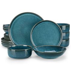 a set of blue dinnerware on a white background