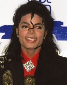 michael jackson is smiling for the camera