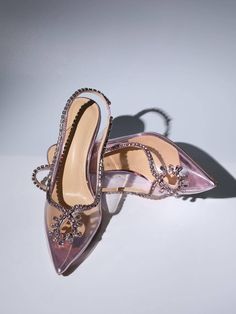 Make a glamorous entrance in the Crystal Cutout Embellished Pumps In Pink. They're made from pink PVC and edged with crystal-encrusted leather trims that form alluring cutouts at the vamps. Approx 8.5 cm / 3.3 inch heel Pointed toe Luxury Crystal-embellished Heels For Prom, Elegant Evening Heels With Rhinestone Rivets, Elegant Formal Heels With Rhinestone Rivets, Glamorous Pink Pointed Toe Heels, Pink Glamorous Heels For Night Out, Pink Embellished Heels For Wedding, Glamorous Pink Heels For Night Out, Glamorous Pink Heels For Party, Luxury Embellished Heels For Prom