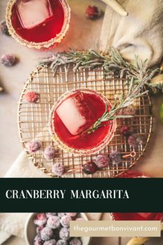 cranberry margarita with rosemary garnish on the rim and two small glasses