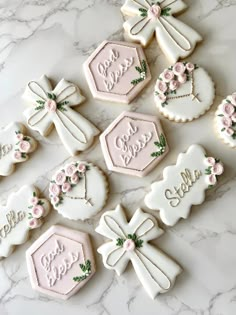 decorated cookies are arranged on a marble surface