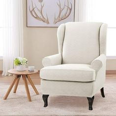 a white chair sitting in front of a window