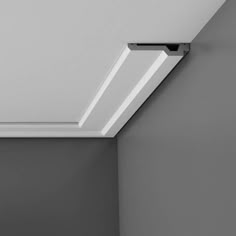 the corner of a room with a ceiling light