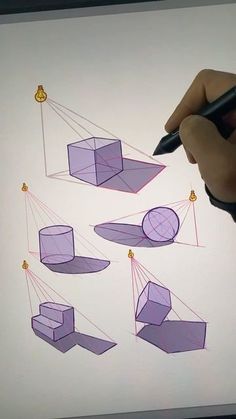 someone is drawing shapes on a white board