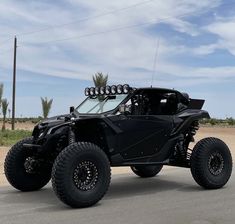 a black four - wheeled vehicle is parked on the street