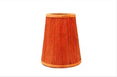 a wooden lamp shade on a white background