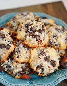 chocolate chip cookies with almonds and coconut on a blue plate