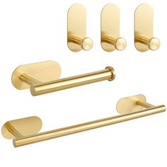 brass bathroom accessories set with towel bar, toilet paper holder and door knobs on white background