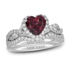 a heart shaped ruby and diamond ring with the name neil lane written on it in white gold