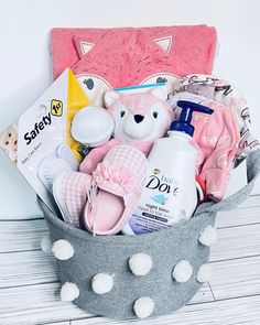 a basket filled with baby items on top of a table