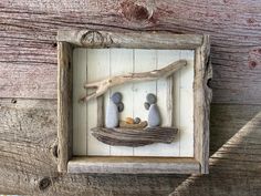 This  completely unique nativity scene is created with flat beach stones, beach glass and driftwood collected from the shores of Lake Michigan.  The rustic frame has been built using whitewashed lathe and barnwood. This piece measures 8"H x 8-3/4"W x 1-1/2"D. Hanging hardware is included on the back. Stone Nativity Scene, Rock Nativity, Stone Ideas, Diy Christmas Tree Ornaments, Rustic Frames, Art Rock, Drift Wood, Beach Stones