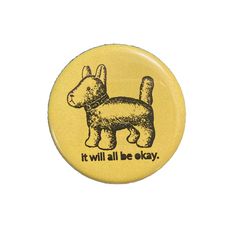 a yellow button with an image of a dog that says it will all be okay