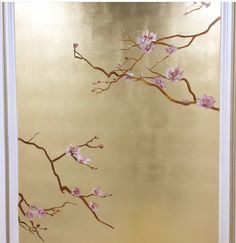 a painting with pink flowers on a gold background