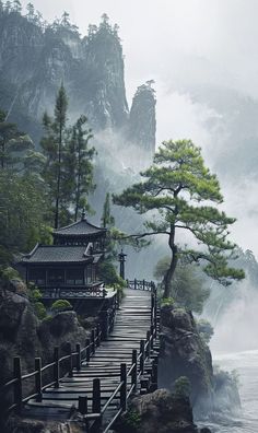 a wooden walkway leading to a small building on top of a mountain