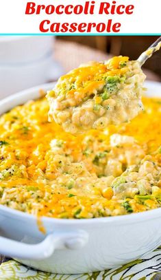 broccoli rice casserole in a white dish with a spoon scooping out