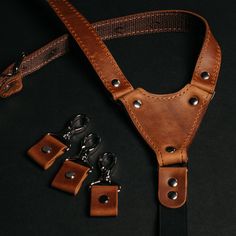 "Men's suspenders in different color variations are made from genuine quality leather and have a pattern with a rubber band on the back and length adjusters on the front. This construction has been worked out for years and brings an excellent fit and a comfortable wearing experience. You can order a set of suspenders and a leather bow tie and create a total look for the groom and groomsmen for a wedding, outfit for any party, or your beloved one. Please note that we are also working with bulk or Ring Bearer Outfit Brown, Groomsmen Belt, Suspenders Ring Bearer, Traditional Belt, Leather Braces, Men's Suspenders, Leather Bow Tie, Suspenders Wedding, Bearer Outfit