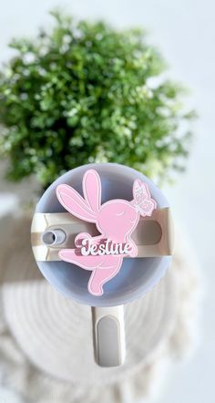 there is a small plastic object with a bunny on it