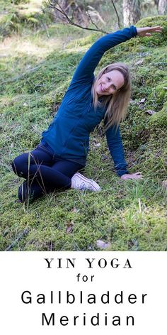 a woman is doing yoga in the grass with her arms stretched out and head down