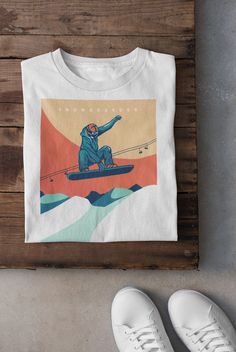 Keywords: UNISEX  Snowboarder T-Shirt ,Vintage Skiing T-Shirt | Ski Lover Hoodie | Skier Sweatshirt, Winter Sports Tee, Asiago Italy Top, Snow Mountain Shirt, Snowboarding Dad Gift Snowboard shirt Ski sweater skier accessories ------------------------------------------------ QUALITY This T-shirt is a UNISEX t-shirt with a vintage illustration and it feels soft and light, with just the right amount of stretch. It features a crew neck, pre-shrunk fabric and side-seamed fit. FIND YOUR SIZE Please find the fitting guide in the pictures to determine your size. Pro Tip: Choose the best size by comparing the measurements of your favorite T-Shirt with the ones listed on the chart. SHIPPING We work with a reliable, high-quality print-on-demand partner with locations in US and the EU, so depending o Ski Hoodie Design, Retro White Winter T-shirt, White T-shirt For Outdoor Winter Activities, Casual Graphic Print Tops For Winter Sports, White Crew Neck Top For Snowboarding, Vintage Skiing, Ski Vintage, Ski Print, Ski Shirts