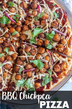 a pizza topped with meatballs and garnished with cilantro, parsley