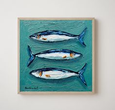 three fish are depicted in this painting on the wall