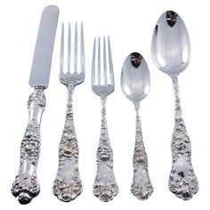 an assortment of silverware including forks, knives and spoons on a white background