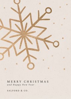 a white and gold christmas card with a snowflake design on it's front