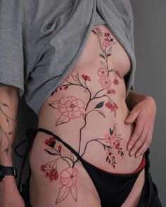 a woman with tattoos on her stomach