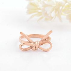 About item Item :-Bow tie knot ribbon ring. Ring size :- Chose from variation (Custom size accepted) Material  :- 925 Sterling silver Purity  :- 92.5 Title: Silver Knot Bow Tie Ring, Dainty Ribbon Ring, Minimalist Band, Everyday Stacking Ring, Tiny bow Ring, Gift for Her, Bow Jewelry,Women's ring, promise ring, Christmas day gift, Proposal ring Description:- We use 925 sterling silver to making jewelry. We accept all types of custom & personalized order. Please send us a message if you are interested in a custom creation. Shipping profile:- We ship all order within 3-5 days. But custom order takes time. Customer service :- If you have any question about our products & services, feel free to contact us. We do always best for our customers Other Specification:- Please Visit Our Shop home pag Bow Tie Ring, Tie Ring, Lily Ring, Ribbon Ring, Twisted Band Ring, Ladies Silver Rings, Knot Bow, Tiny Bow, Friendship Rings