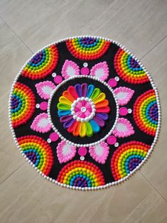 a colorful flower design is on the floor