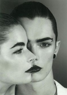 black and white photograph of two women with their faces close together