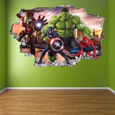 the avengers wall sticker is in an empty room with green walls and hardwood flooring