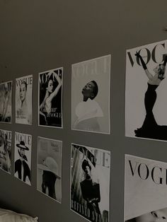 black and white photograph of magazine covers on the wall above a bed in a bedroom