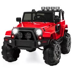 a red toy truck with four wheels and lights