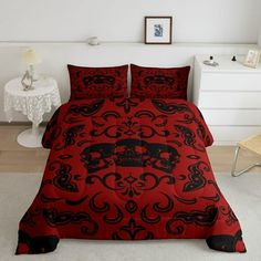 a bed with red and black skulls on it