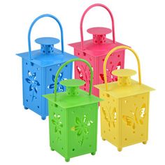 four different colored lanterns with handles