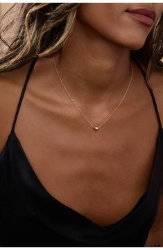 Polish your look with the simple, minimalist design of this delicate linked chain adorned with a solo gleaming bead slider. 16" length 14k-gold fill Made in the USA Atolea Jewelry Necklace, Caitlin Minimalist Jewelry, Minimalist Solitaire Necklace With Adjustable Chain, Gold Minimalist Solitaire Necklace, Minimalist Gold Solitaire Necklace, Dainty Gold Solitaire Necklace For Everyday, Simple 14k Gold-filled Necklace, Simple Everyday Solitaire Necklace, Everyday Simple Solitaire Necklace