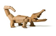 a wooden toy that looks like a dinosaur