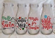 three glass bottles with santa's milk for santa written on them